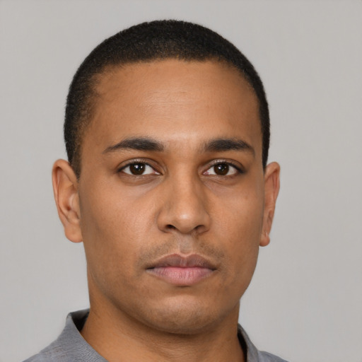 Neutral latino young-adult male with short  brown hair and brown eyes