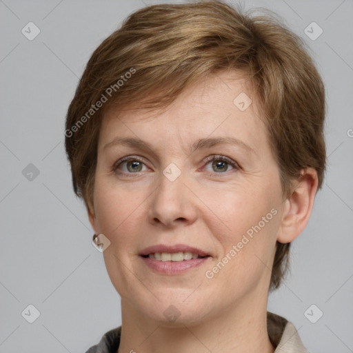 Joyful white adult female with short  brown hair and grey eyes