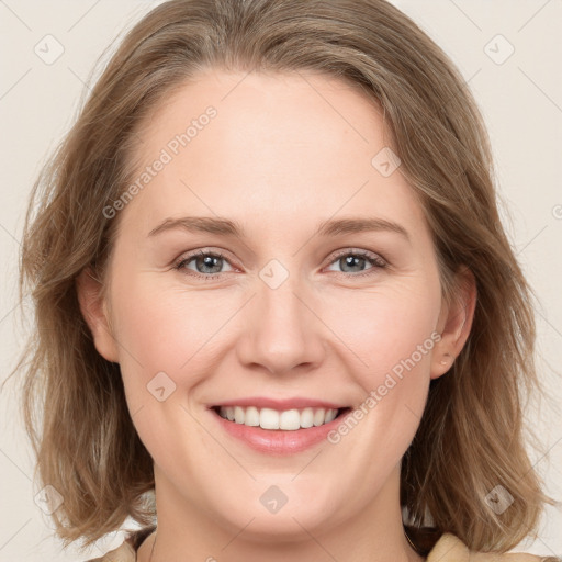 Joyful white young-adult female with medium  brown hair and blue eyes