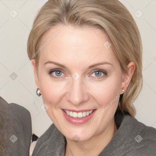 Joyful white adult female with medium  brown hair and blue eyes