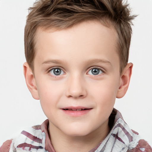 Joyful white child male with short  brown hair and blue eyes