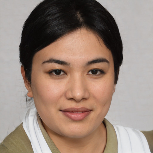 Joyful asian young-adult female with medium  brown hair and brown eyes