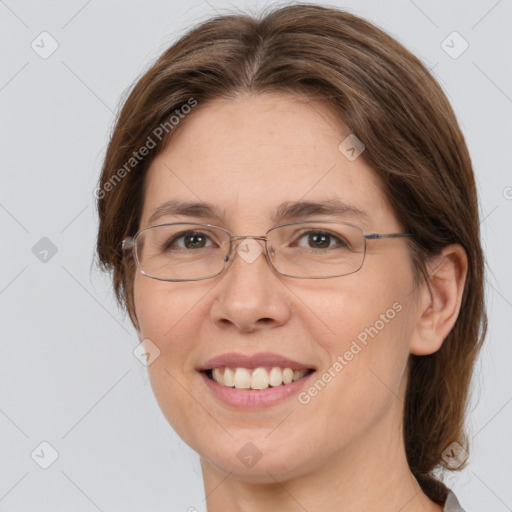 Joyful white adult female with medium  brown hair and grey eyes