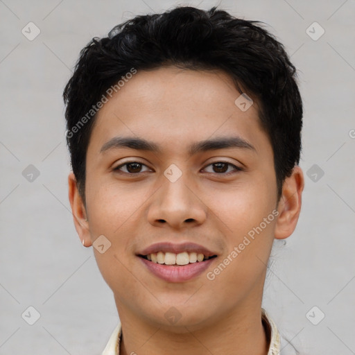 Joyful latino young-adult male with short  black hair and brown eyes