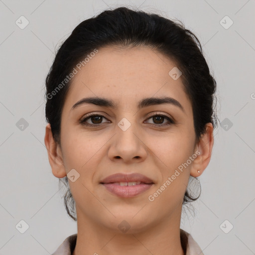 Joyful latino young-adult female with medium  brown hair and brown eyes