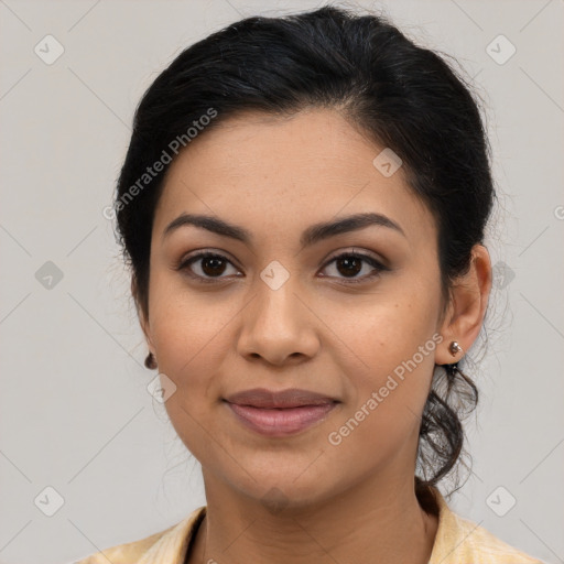 Joyful latino young-adult female with medium  brown hair and brown eyes