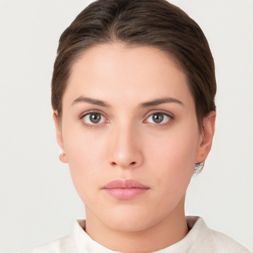 Neutral white young-adult female with short  brown hair and brown eyes