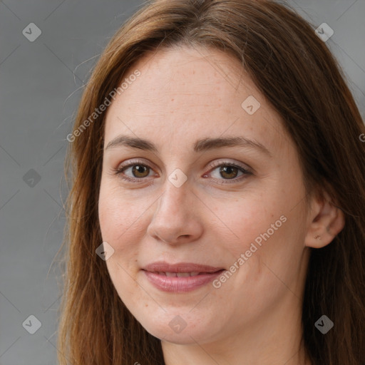 Joyful white young-adult female with long  brown hair and brown eyes