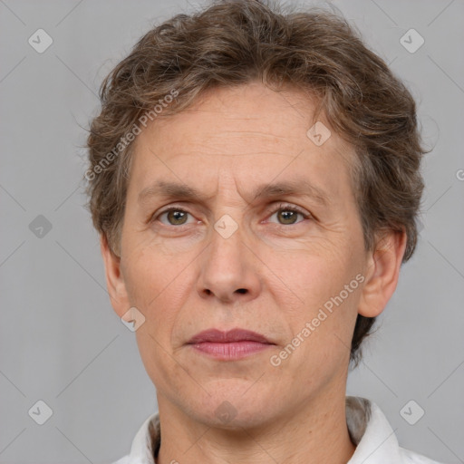 Joyful white adult male with short  brown hair and grey eyes