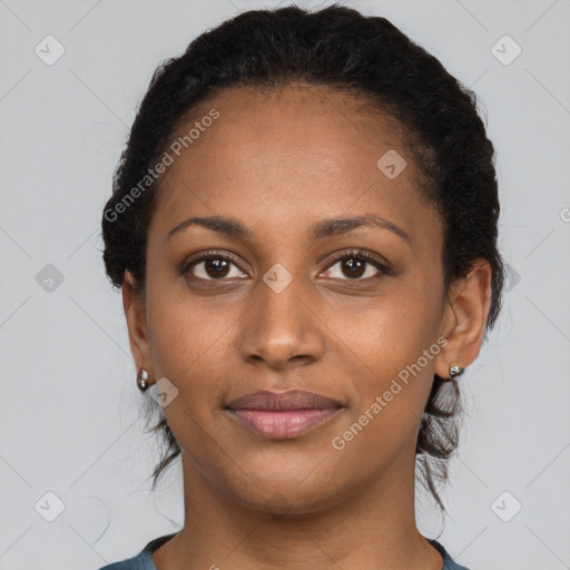 Joyful black young-adult female with medium  black hair and brown eyes