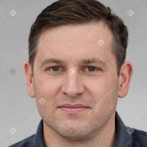 Joyful white adult male with short  brown hair and grey eyes