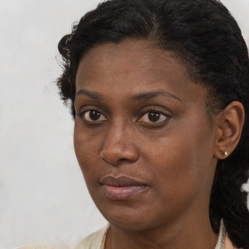 Neutral black young-adult female with short  brown hair and brown eyes