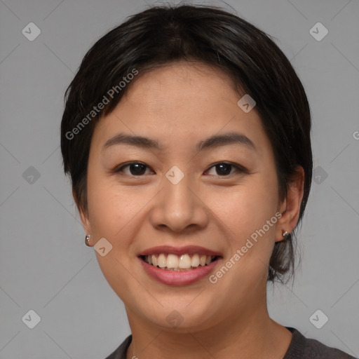 Joyful asian young-adult female with medium  brown hair and brown eyes