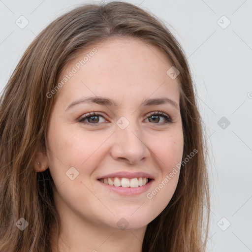 Joyful white young-adult female with long  brown hair and grey eyes