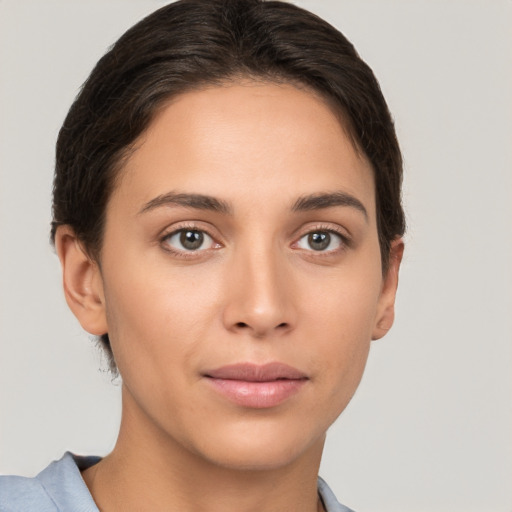 Joyful white young-adult female with short  brown hair and brown eyes