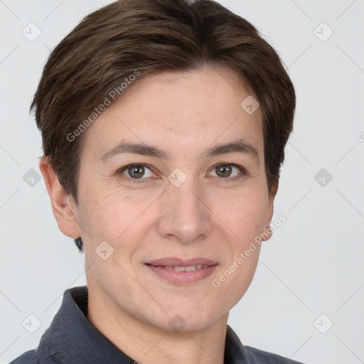 Joyful white adult female with short  brown hair and grey eyes