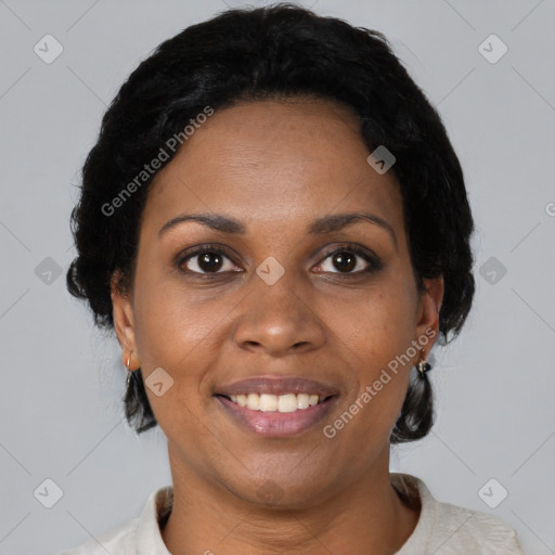 Joyful black adult female with short  black hair and brown eyes