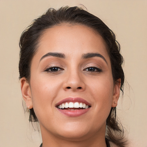 Joyful white young-adult female with medium  brown hair and brown eyes