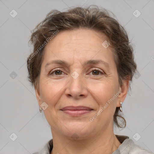 Joyful white adult female with short  brown hair and brown eyes