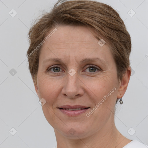 Joyful white adult female with short  brown hair and grey eyes