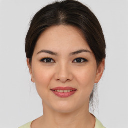 Joyful asian young-adult female with medium  brown hair and brown eyes