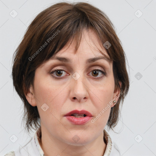 Joyful white adult female with medium  brown hair and brown eyes