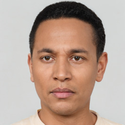 Neutral latino adult male with short  black hair and brown eyes