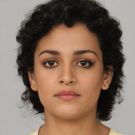 Neutral latino young-adult female with medium  brown hair and brown eyes