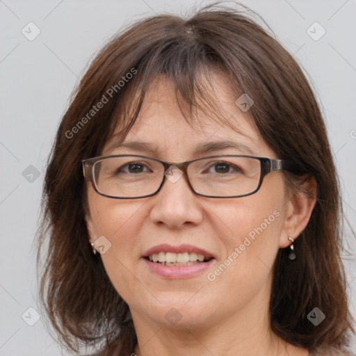 Joyful white adult female with medium  brown hair and grey eyes