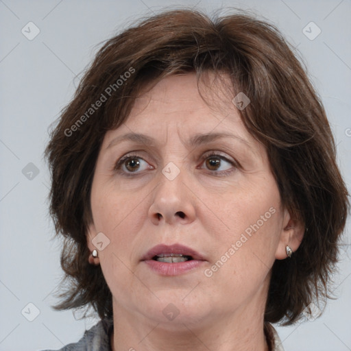 Joyful white adult female with medium  brown hair and brown eyes