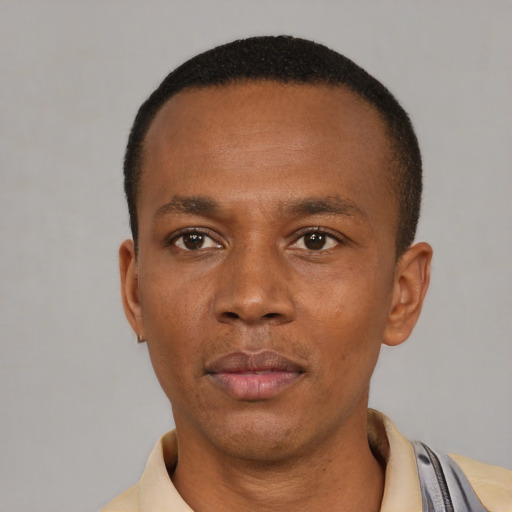 Neutral latino young-adult male with short  brown hair and brown eyes