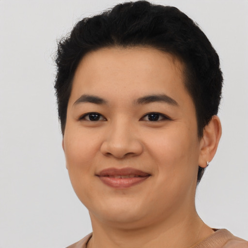 Joyful asian young-adult female with short  black hair and brown eyes