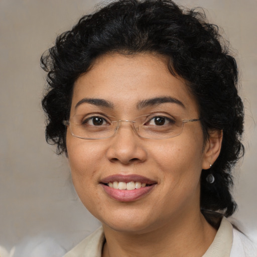 Joyful latino adult female with short  brown hair and brown eyes