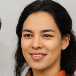 Joyful asian young-adult female with medium  brown hair and brown eyes