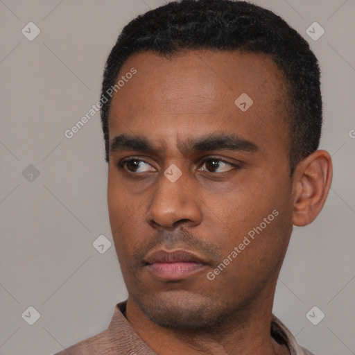 Neutral latino young-adult male with short  black hair and brown eyes