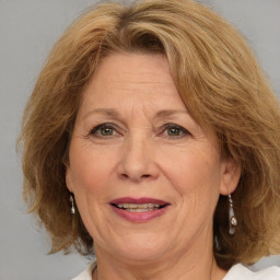 Joyful white middle-aged female with medium  brown hair and brown eyes