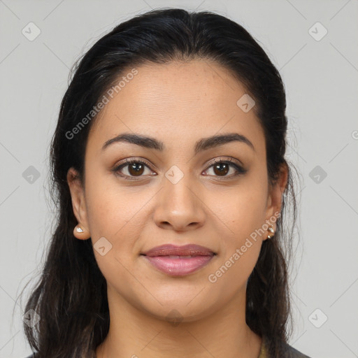 Joyful latino young-adult female with long  brown hair and brown eyes