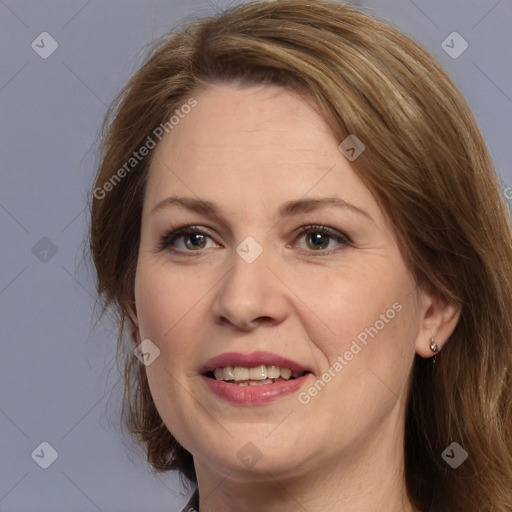 Joyful white adult female with long  brown hair and brown eyes