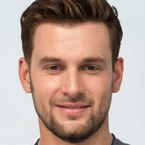 Joyful white young-adult male with short  brown hair and brown eyes