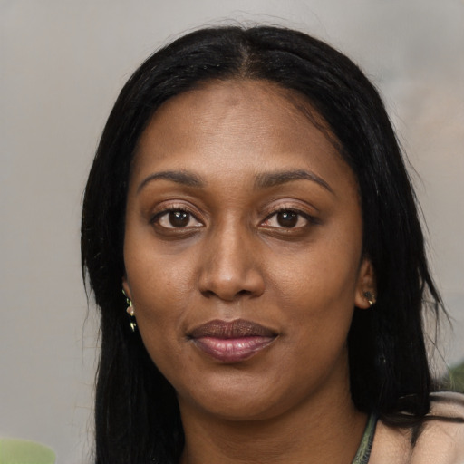 Joyful latino young-adult female with long  black hair and brown eyes