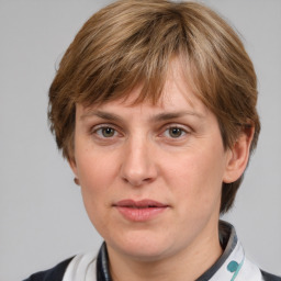 Joyful white adult female with medium  brown hair and grey eyes