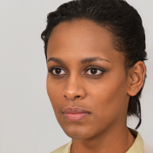 Neutral black young-adult female with short  brown hair and brown eyes