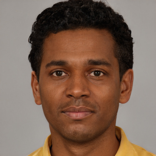 Neutral black young-adult male with short  black hair and brown eyes
