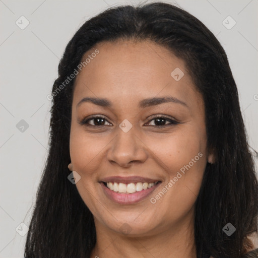 Joyful latino young-adult female with long  black hair and brown eyes