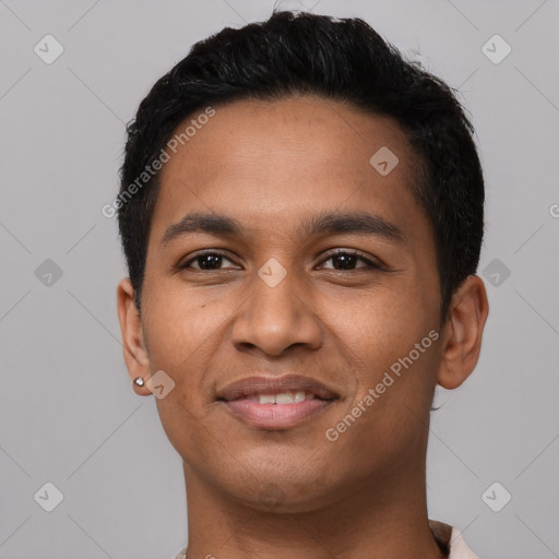 Joyful latino young-adult male with short  black hair and brown eyes