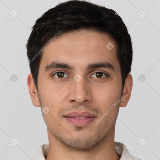 Joyful white young-adult male with short  brown hair and brown eyes