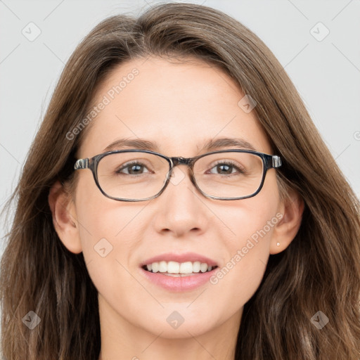 Joyful white adult female with long  brown hair and brown eyes