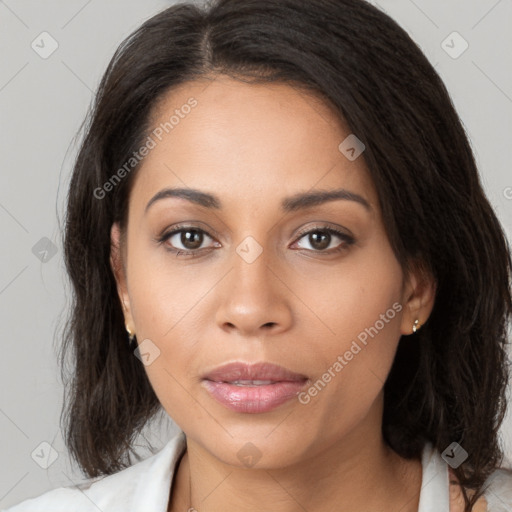 Joyful latino young-adult female with long  brown hair and brown eyes