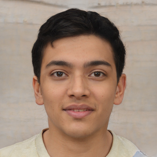 Joyful asian young-adult male with short  brown hair and brown eyes