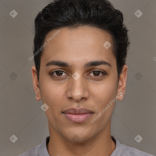 Joyful latino young-adult male with short  brown hair and brown eyes